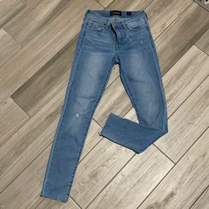 Lightly distressed skinny jeans, light wash